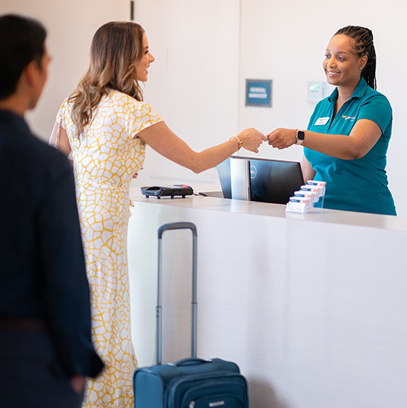 Woman checking in at extended stay front desk